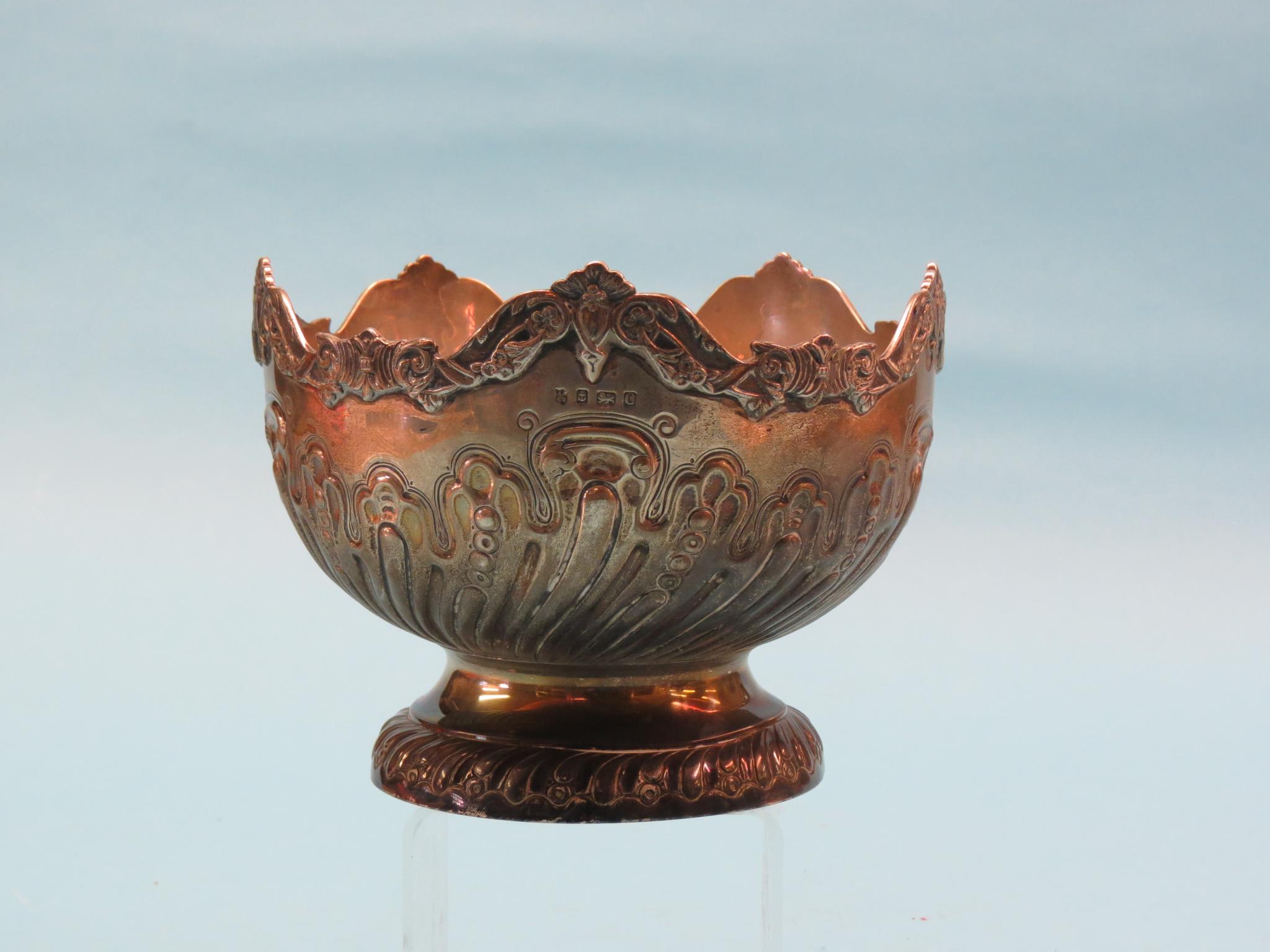 Appraisal: A silver fruit bowl embossed wrythen ornament with cast border