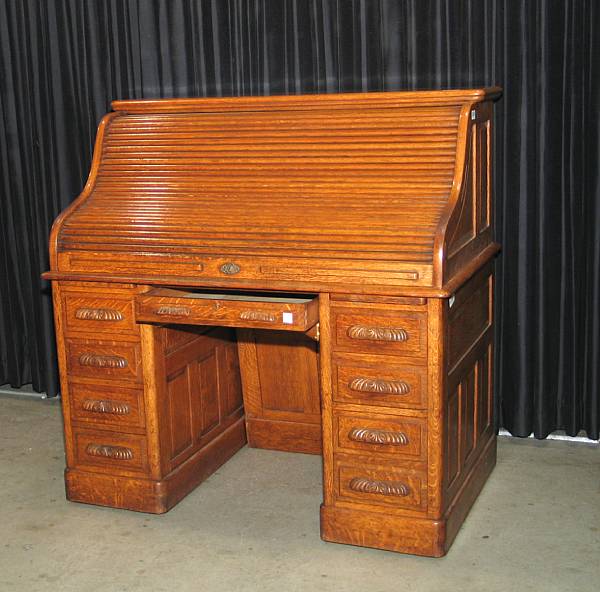 Appraisal: An oak roll top desk late th early th century