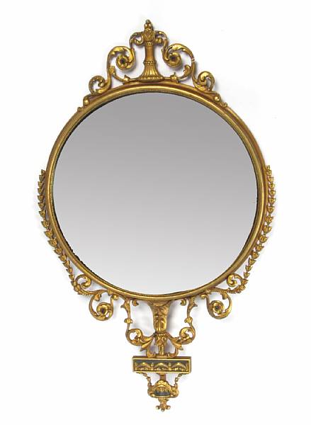 Appraisal: An Empire style parcel ebonized giltwood mirror height in width