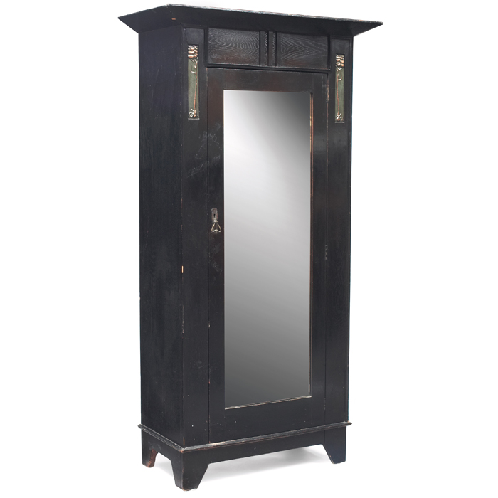 Appraisal: English Arts and Crafts wardrobe mirrored door flanked by copper