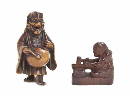 Appraisal: Two Boxwood Netsuke one of an oni fashioning a club