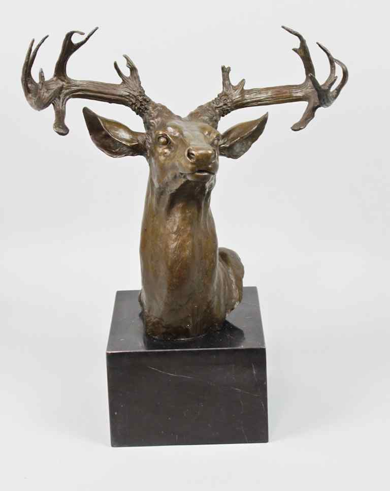 Appraisal: PATINATED METAL BUST OF A STAG bearing the signature DEBUT