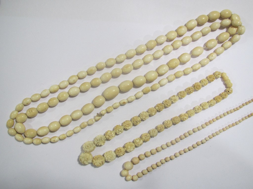 Appraisal: Lot comprising a string of floral carved ivory beads a