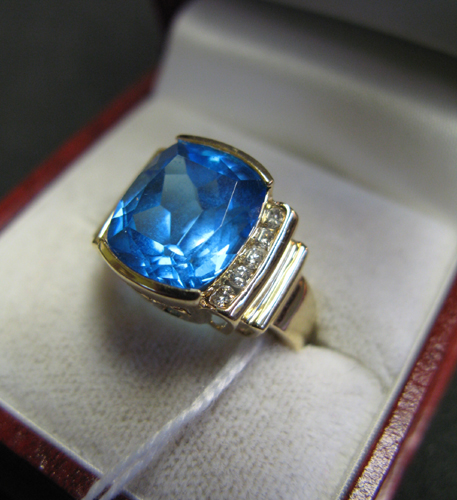 Appraisal: BLUE TOPAZ DIAMOND AND FOURTEEN KARAT GOLD RING centered is