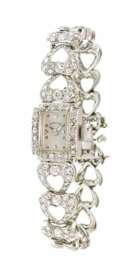 Appraisal: A Platinum and Diamond Wristwatch Hamilton containing numerous round brilliant