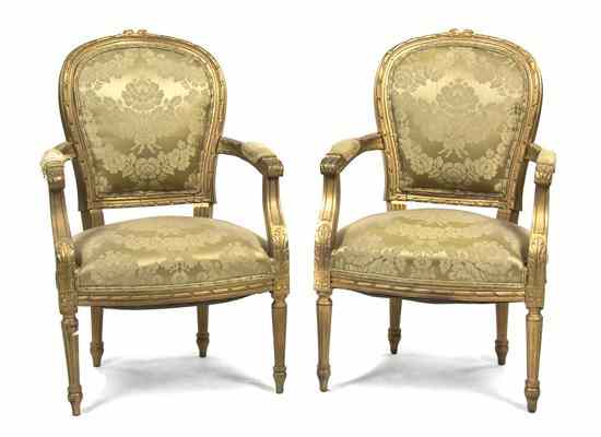 Appraisal: A Pair of Louis XVI Style Giltwood Fauteuils each having