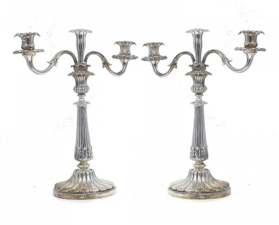 Appraisal: A PAIR OF VICTORIAN CANDELABRA of three lights with floriform