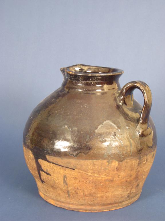 Appraisal: A large th Century slipware Jug with dark brown treacle