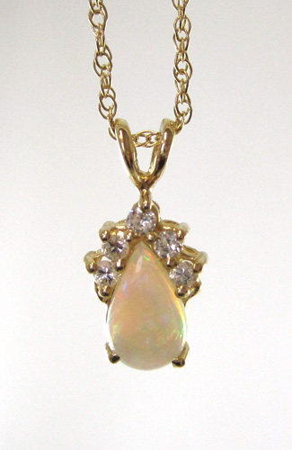 Appraisal: OPAL AND FOURTEEN KARAT GOLD PENDANT NECKLACE suspended on a