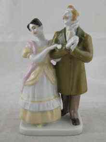 Appraisal: A Russian ceramic figure of a lady and gentleman Menilov