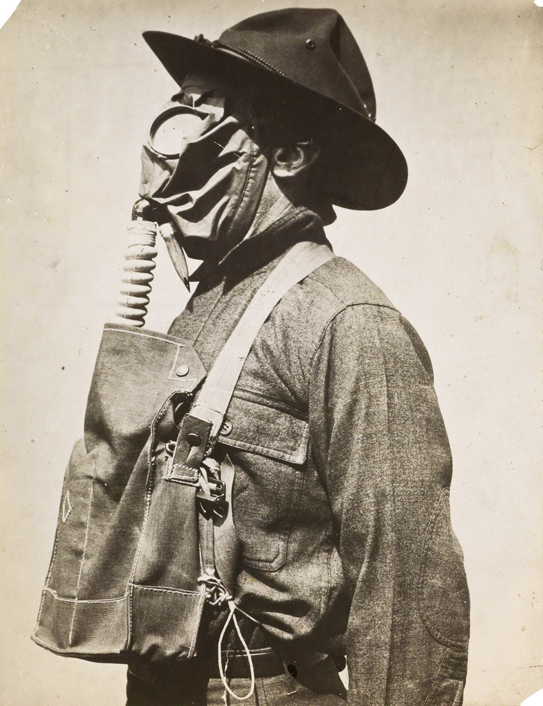 Appraisal: GAS MASKS A group of chilling photographs depicting people wearing