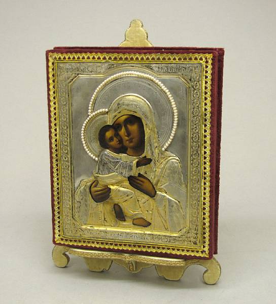 Appraisal: A Russian painted wood icon with silver gilt and beaded