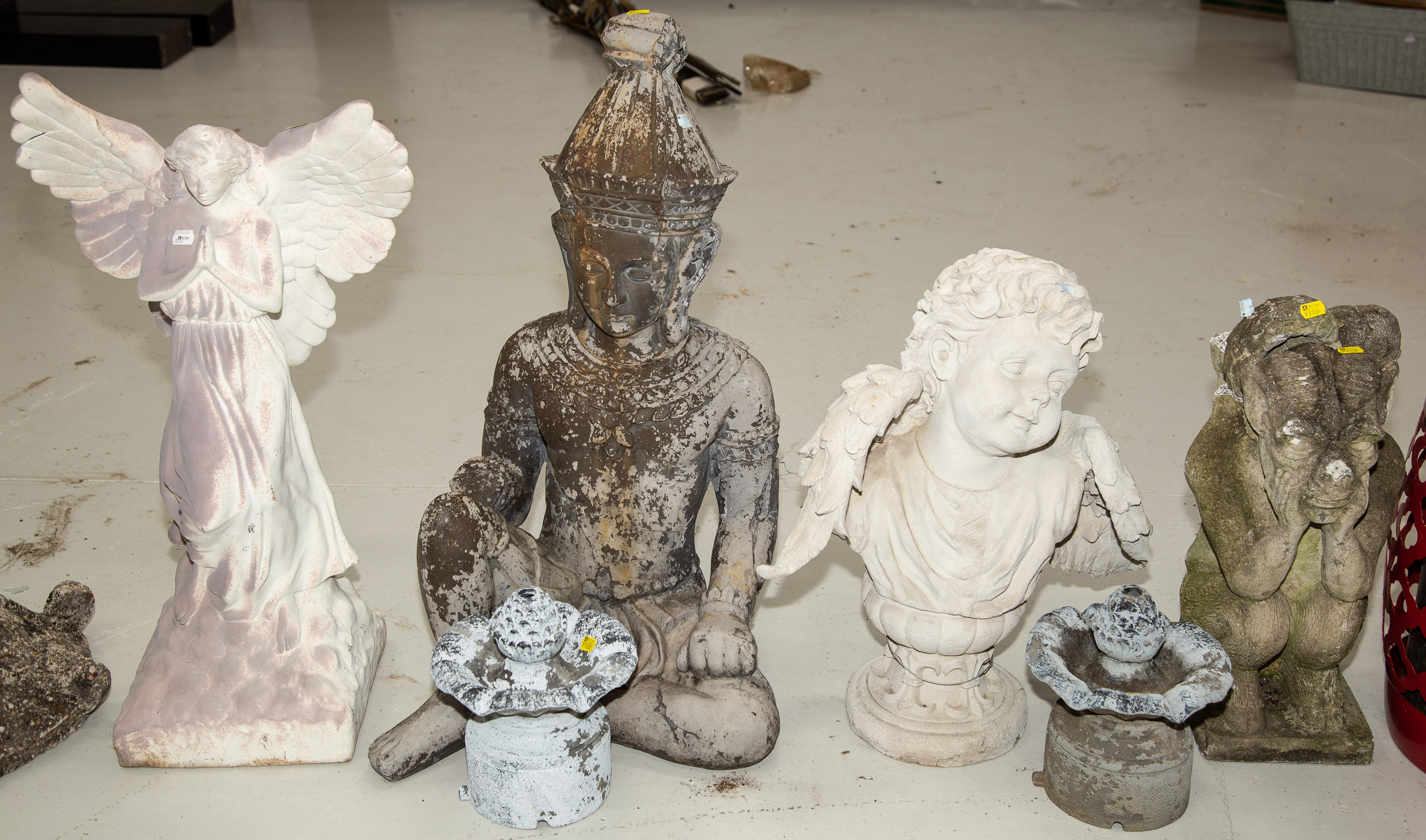 Appraisal: ASSORTED GARDEN DECORATIONS Includes composition angel in H putti in