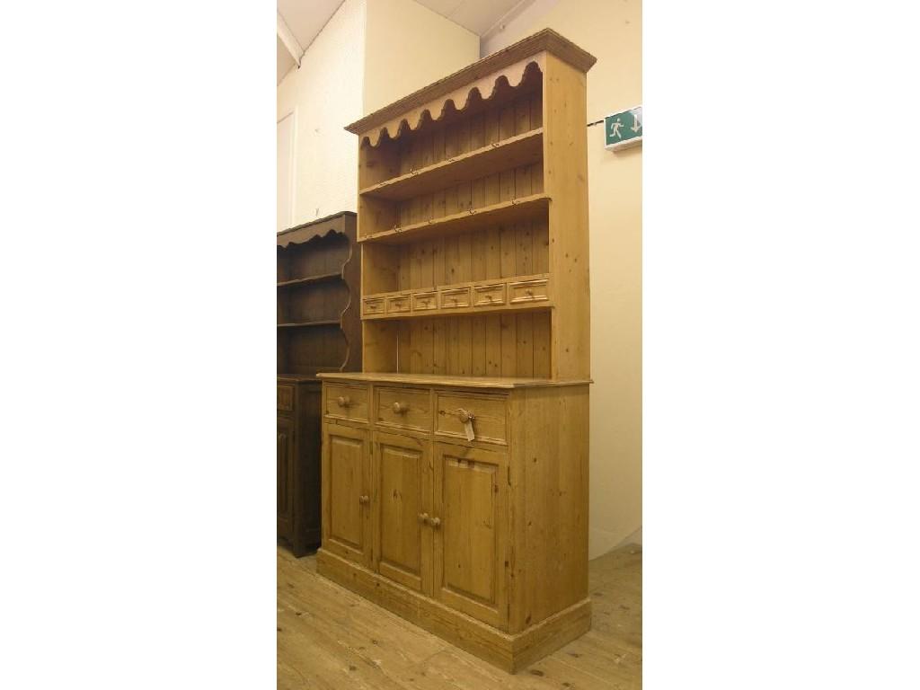 Appraisal: A large waxed pine dresser three-shelf plate rack with six