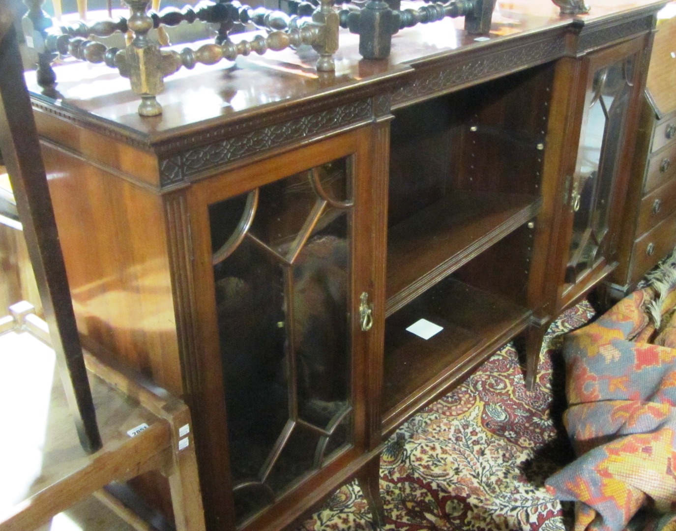 Appraisal: A mahogany display cabinet stamped 'Maple Co'