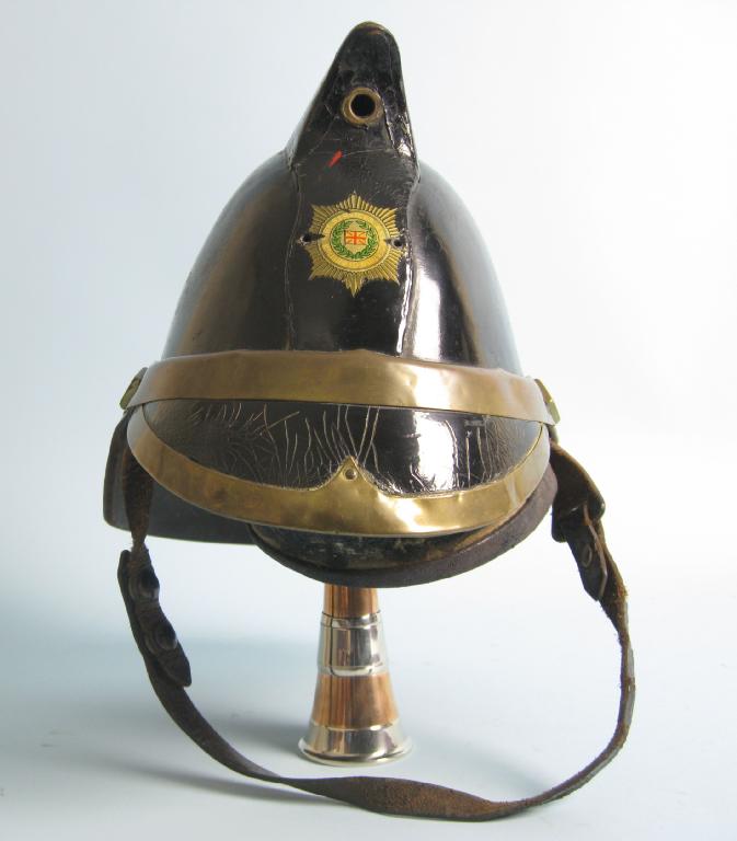 Appraisal: An early Edwardian black leather Fireman's Helmet brass mount with