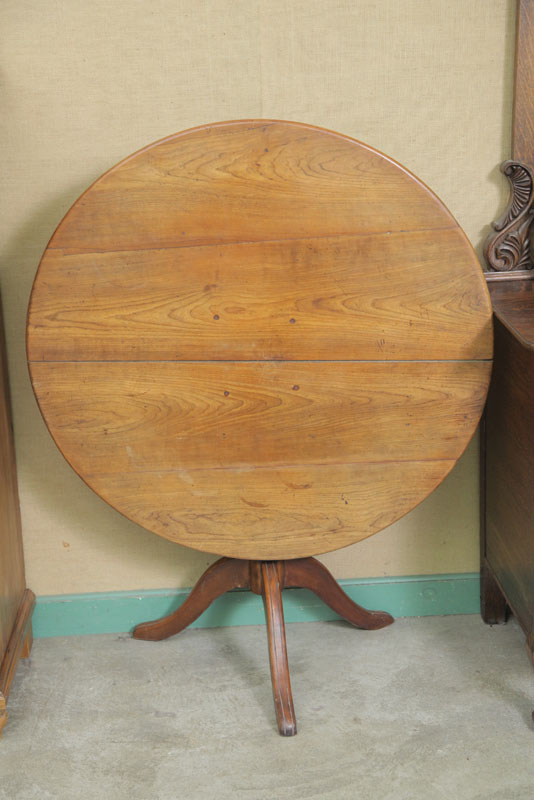 Appraisal: TILT TOP TABLE Walnut having a round top on a