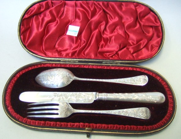 Appraisal: A Victorian silver three piece christening set comprising a knife