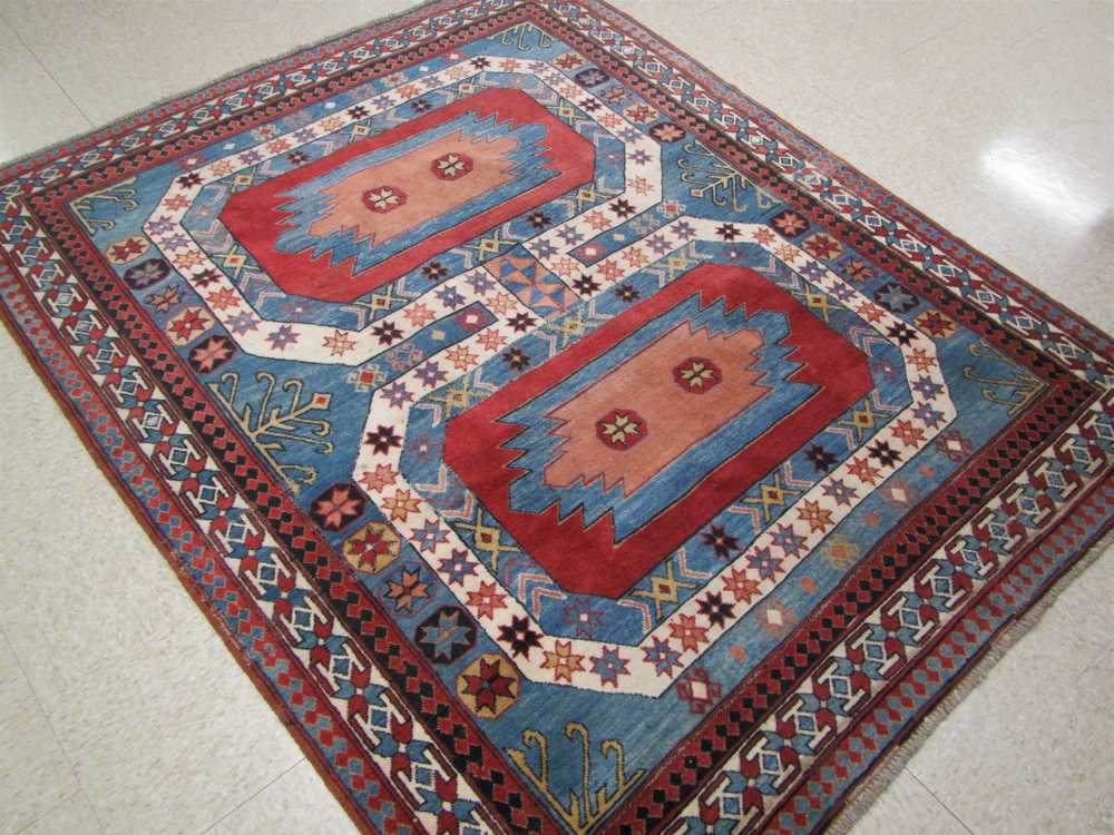 Appraisal: HAND KNOTTED ORIENTAL AREA RUG Pakistani Caucasian double geometric medallion