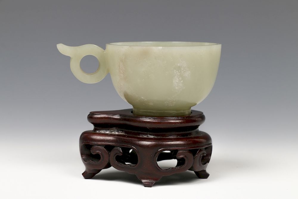 Appraisal: CHINESE NEPHRITE TEACUP WITH CARVED HANDLES TH C In overall