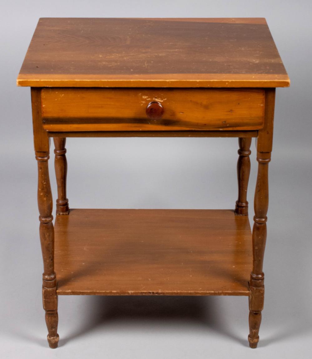 Appraisal: COLONIAL STYLE SIDE TABLE the rectangular top above a frieze