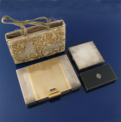 Appraisal: A square parcel-gilt compact by Boucheron and a large parcel-gilt