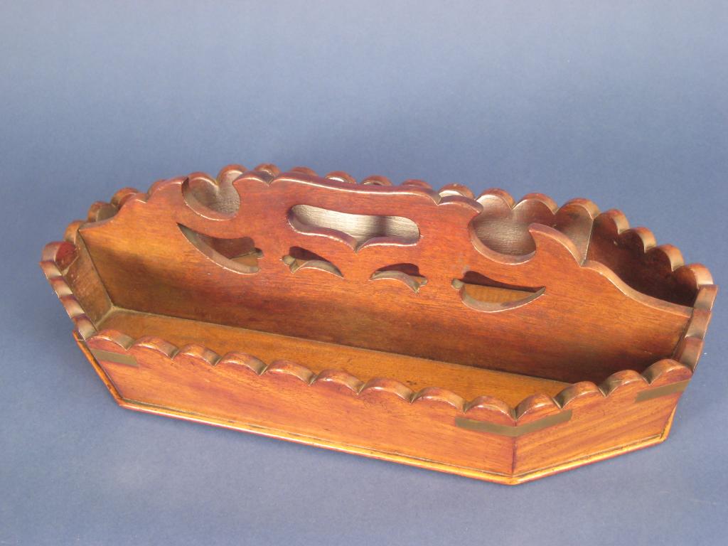 Appraisal: A Georgian mahogany brass bound octagonal two division Knife Tray