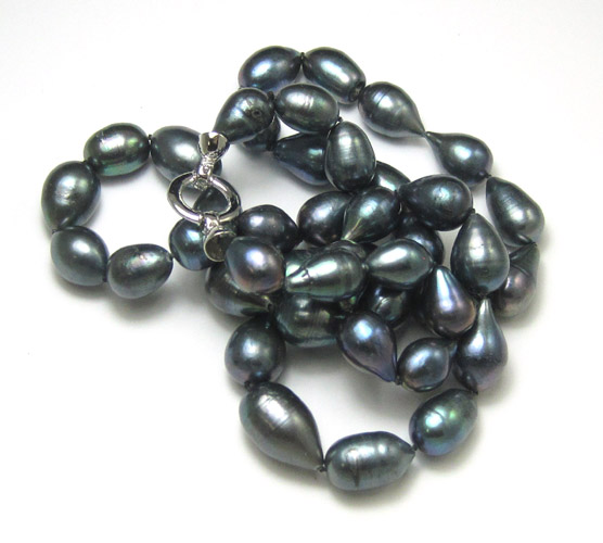 Appraisal: BLACK BAROQUE PEARL NECKLACE with egg and pear shaped pearls