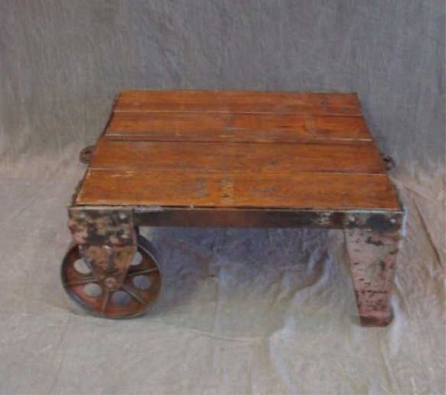 Appraisal: Wood iron wheeled stand From a Westport CT home Dimensions