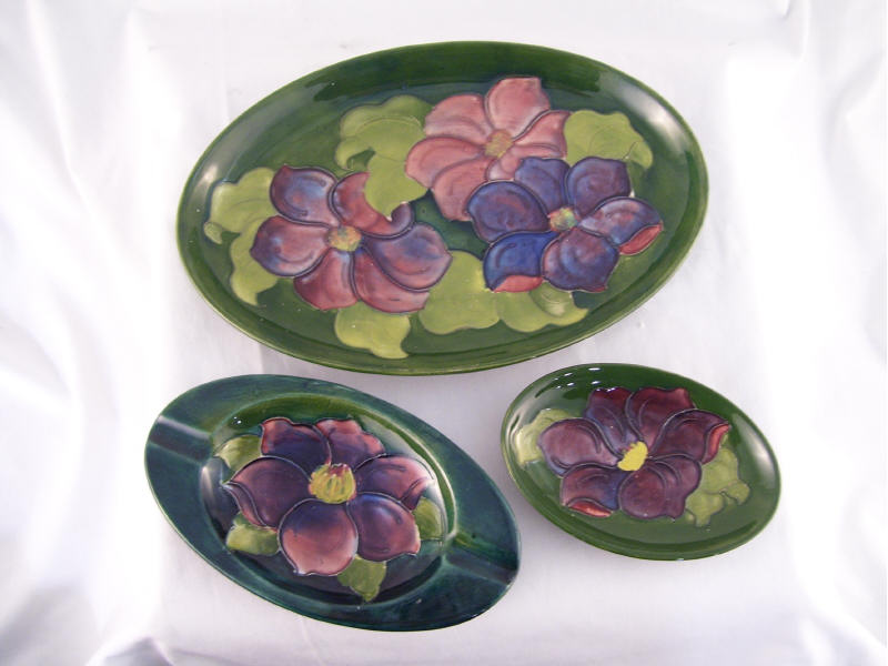 Appraisal: pc Moorcroft Pottery Lot Lot includes Oval dish with green