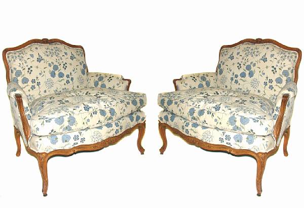 Appraisal: A pair of Louis XV style fruitwood bergeres height in