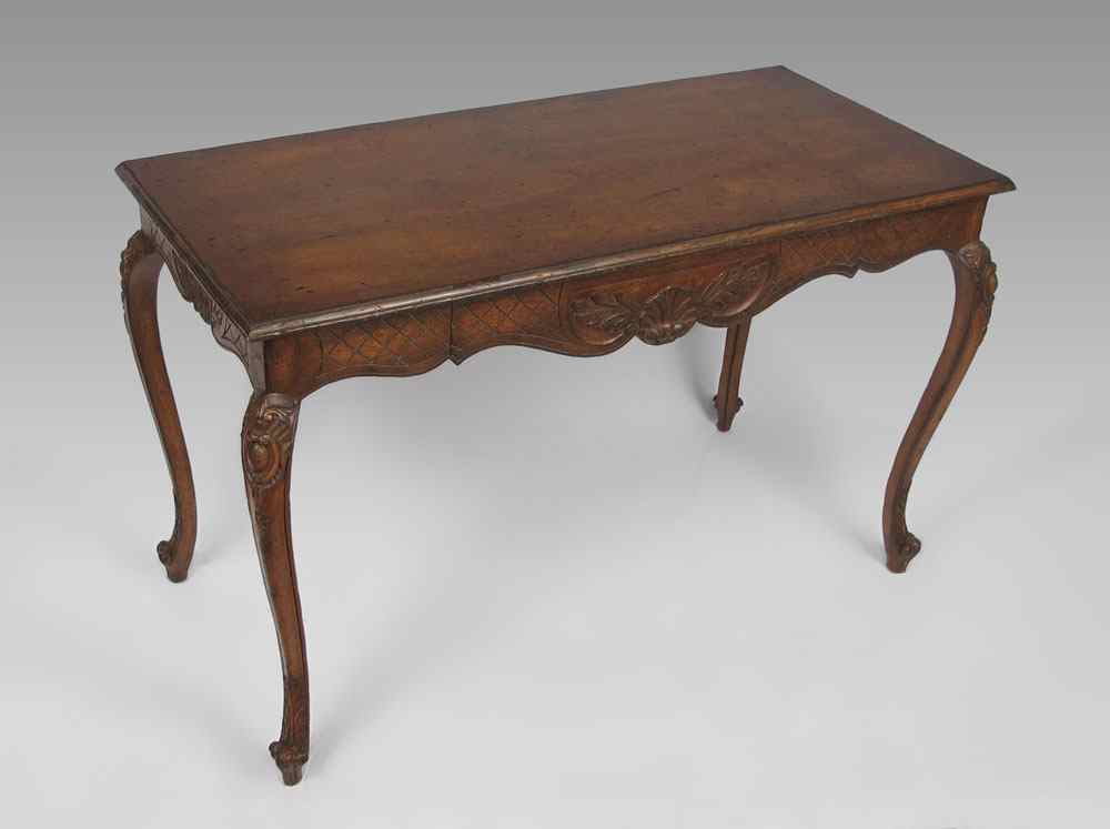 Appraisal: LOUIS XV STYLE FRUITWOOD DESK Carved skirt with single drawer