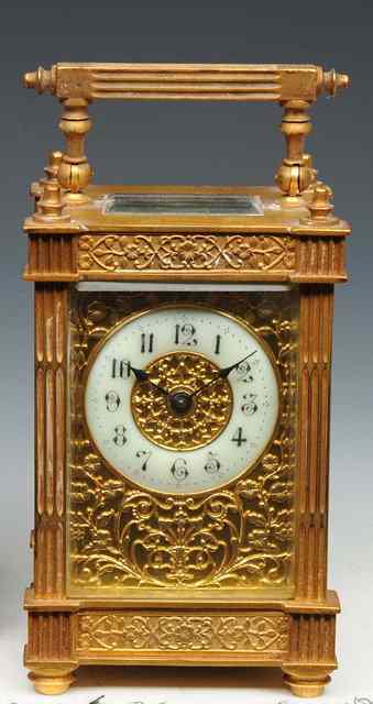 Appraisal: A GILT BRASS CARRIAGE TIMEPIECE the enamel chapter ring with