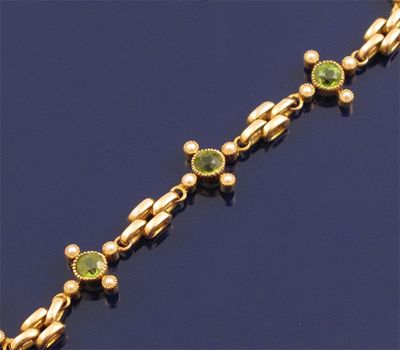 Appraisal: An Edwardian gold gate link bracelet set with clusters of