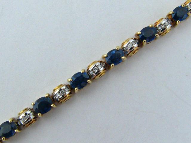 Appraisal: k yellow gold diamond and sapphire tennis style bracelet with