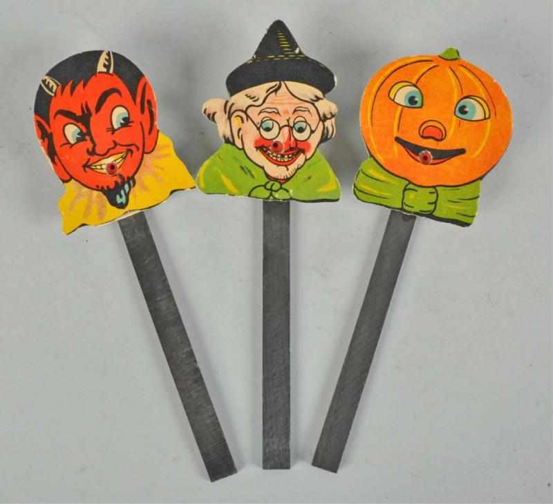 Appraisal: Lot of Cardboard Halloween Squeak Toys Description Includes pumpkin witch