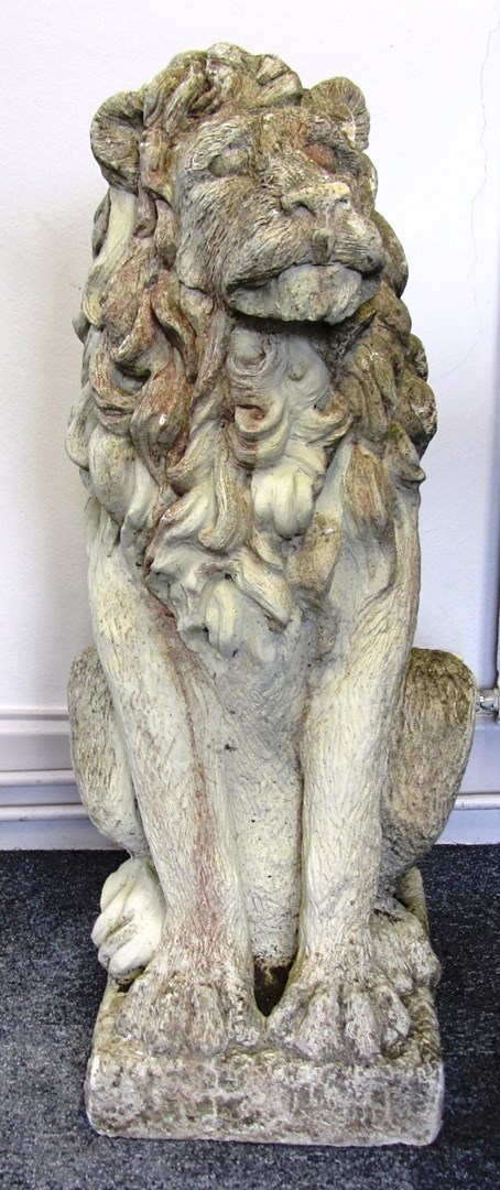 Appraisal: A pair of reconstituted stone figures of seated lions cm