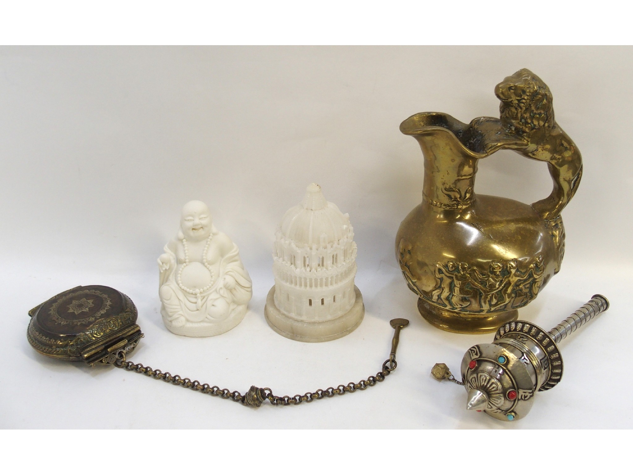 Appraisal: A cast bronze jug a Tibetan prayer wheel a gau