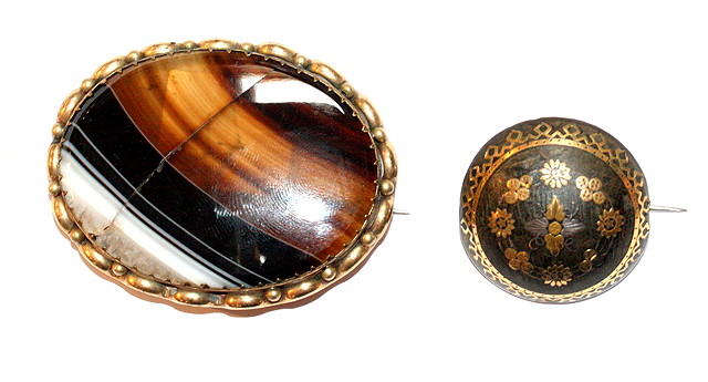 Appraisal: A TORTOISESHELL AND PIQU WORK CIRCULAR BROOCH with flower decoration