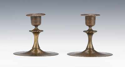 Appraisal: A Pair of Roycroft Candlesticks ca Hammered finish candlesticks with