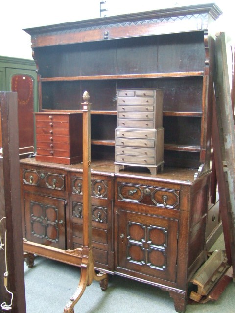 Appraisal: An th century style oak dresser the enclosed three tier