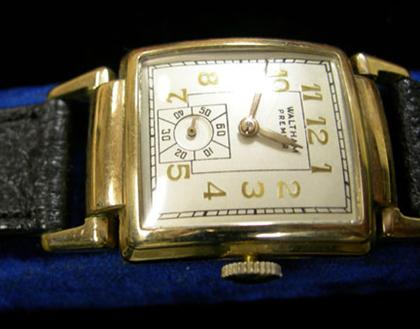 Appraisal: Gentleman's Waltham Premier wristwatch s Rectangular offwhite face with gold