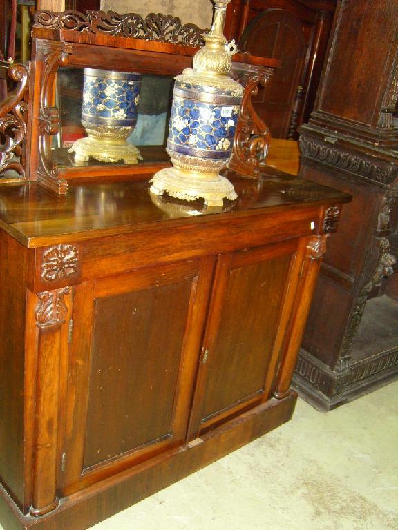 Appraisal: A William IV rosewood chiffonier fitted with a frieze drawer