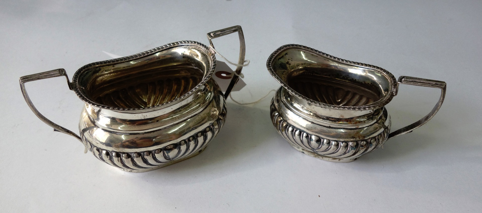 Appraisal: An Edwardian silver two handled sugar basin and milk jug