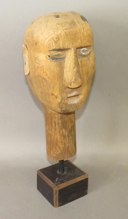 Appraisal: PRIMITIVE FOLK ART CARVED HEAD ON WOODEN DISPLAY Sca late