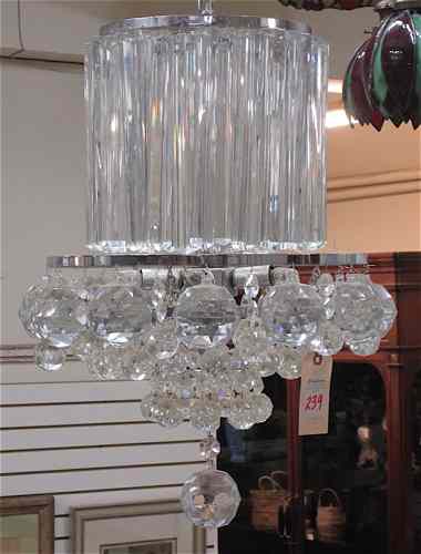 Appraisal: CRYSTAL CHANDELIER a round -light chandelier with a ring of