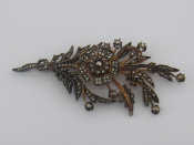 Appraisal: A large gilt metal tests silver diamond spray brooch lacking