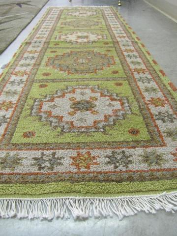 Appraisal: A handmade Oriental area rug Kazak design sage field tan