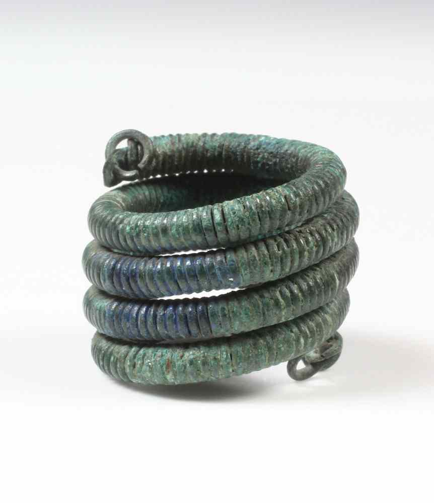 Appraisal: SPIRAL BRONZE AGE FINGER RING Probably Celtic- of colorfully patinated