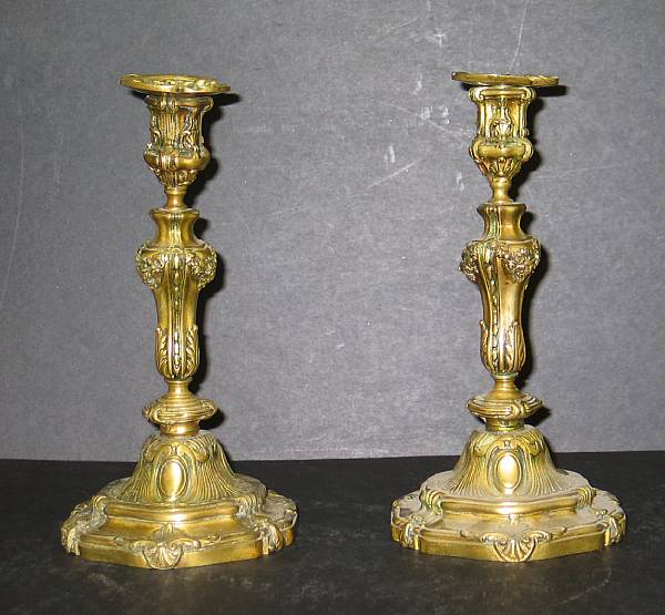 Appraisal: A pair of Louis XV style gilt bronze candlesticks late